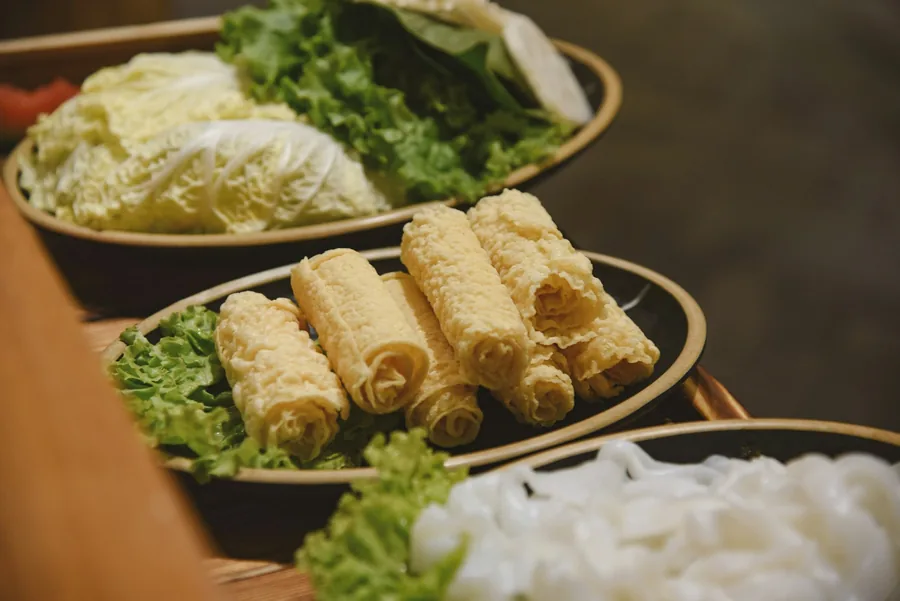 Rolls served on a plate with vegetables