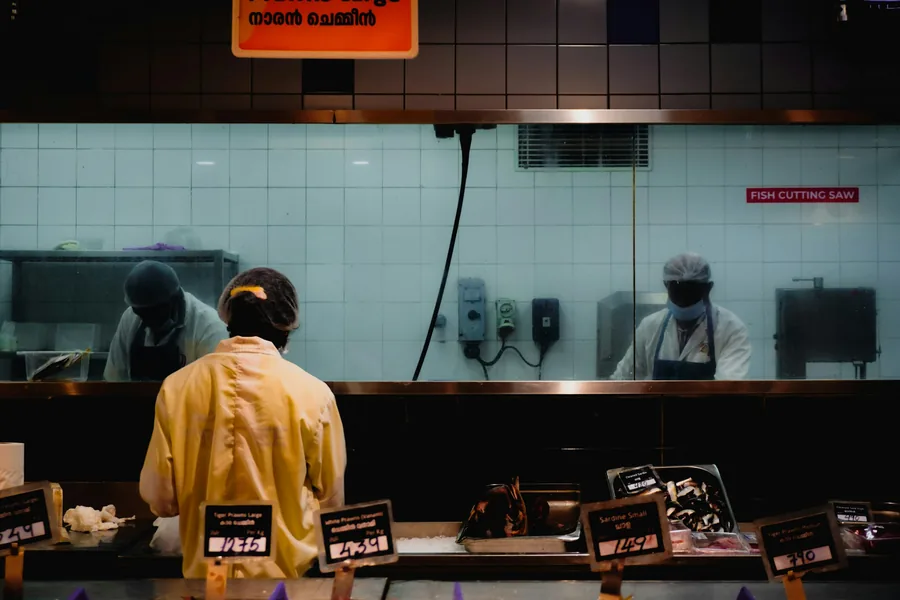 Collecting a food order at a takeaway counter