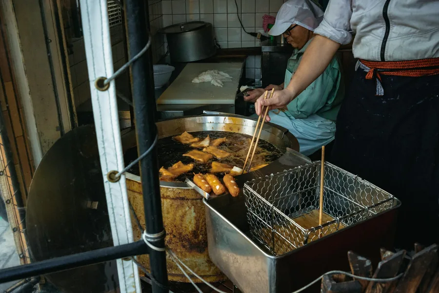 Fryer baskets in a restaurant kitchen