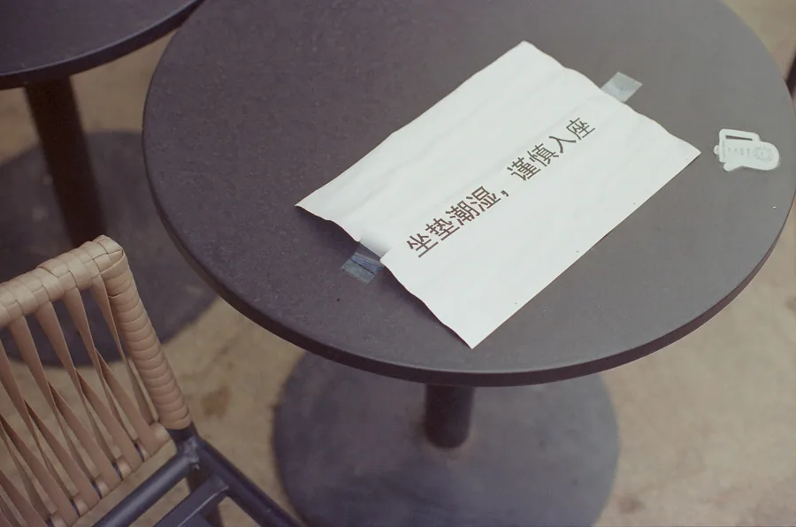 A folded bill left on a table