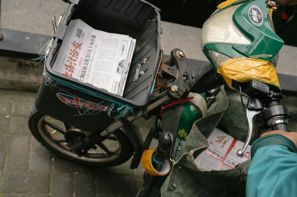 A courier bike loaded with delivery bags