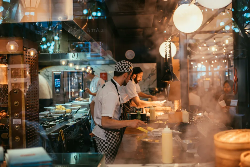 Cooks working through a busy service