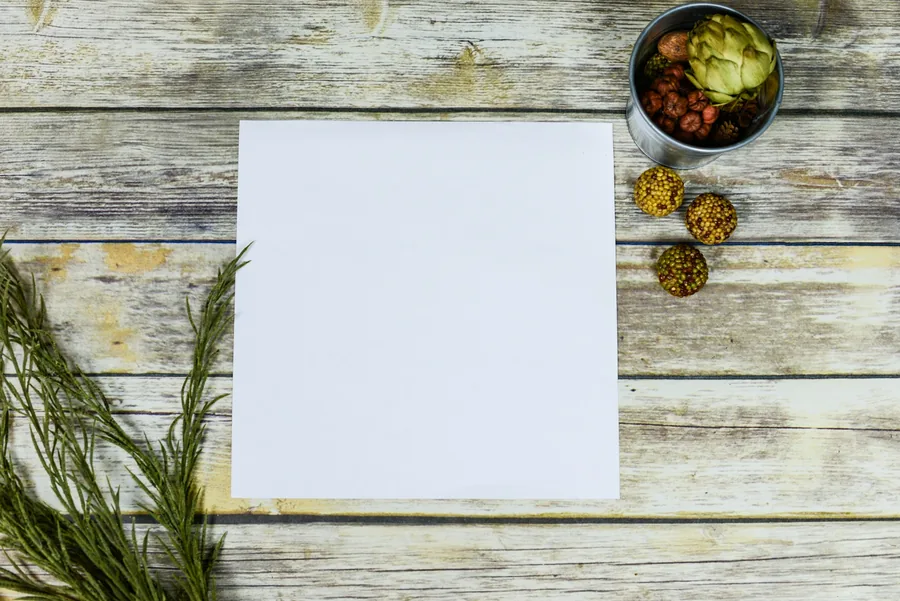 Writing notes on paper beside food