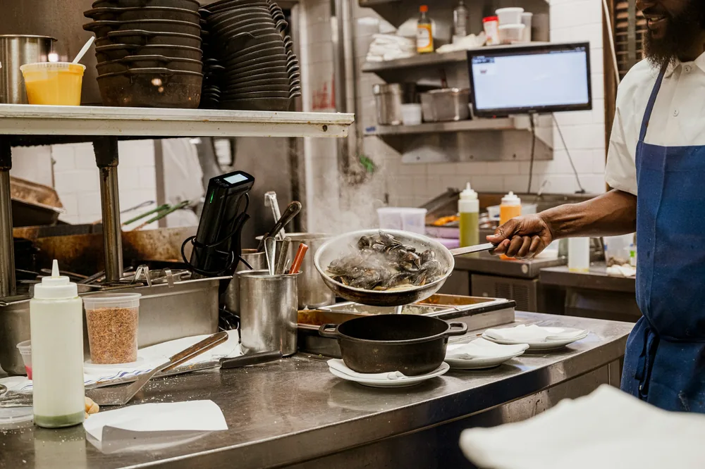 A busy restaurant kitchen pass during service