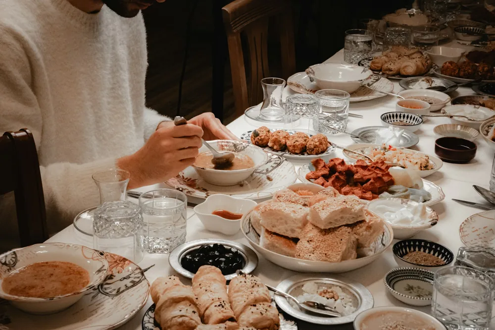 A long table covered with shared dishes