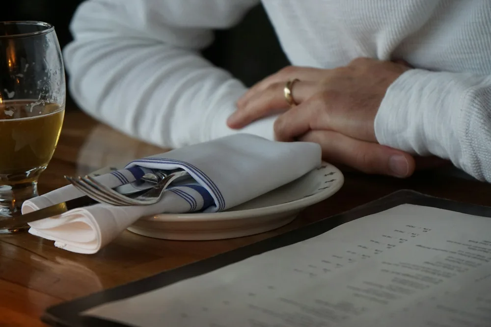 A menu open on a restaurant table
