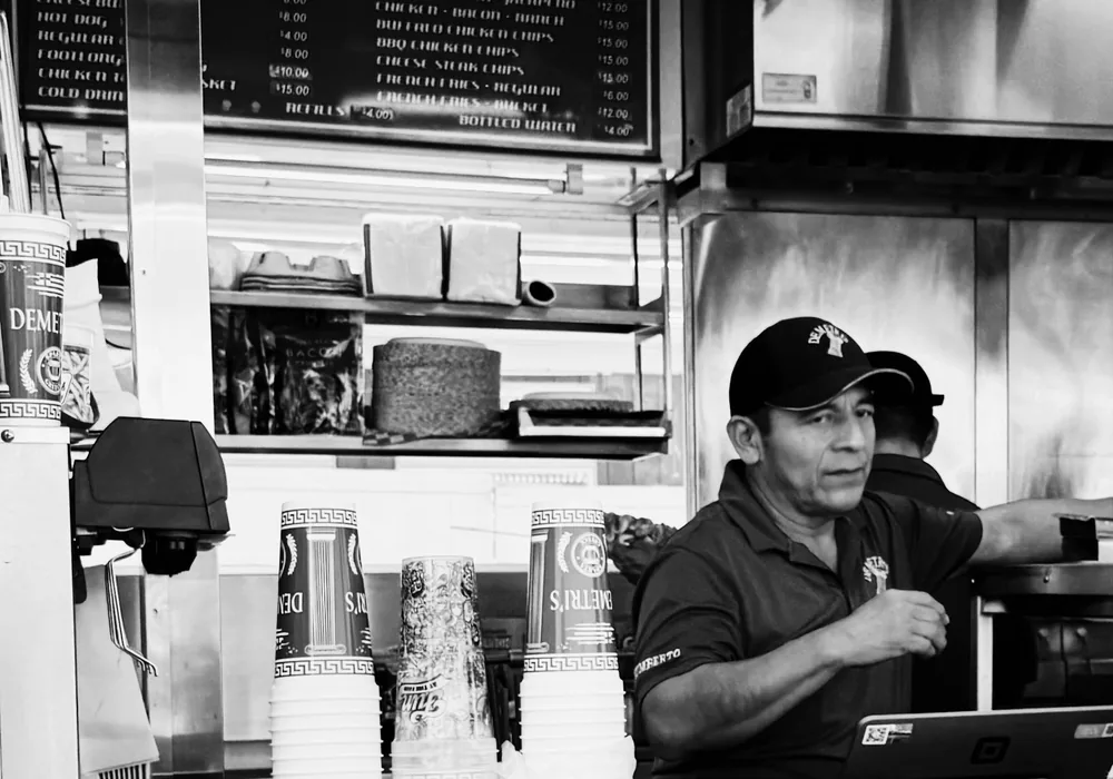 Staff taking an order at a takeaway counter