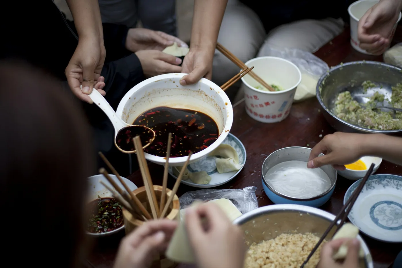 People sharing Chinese appetizers around a table