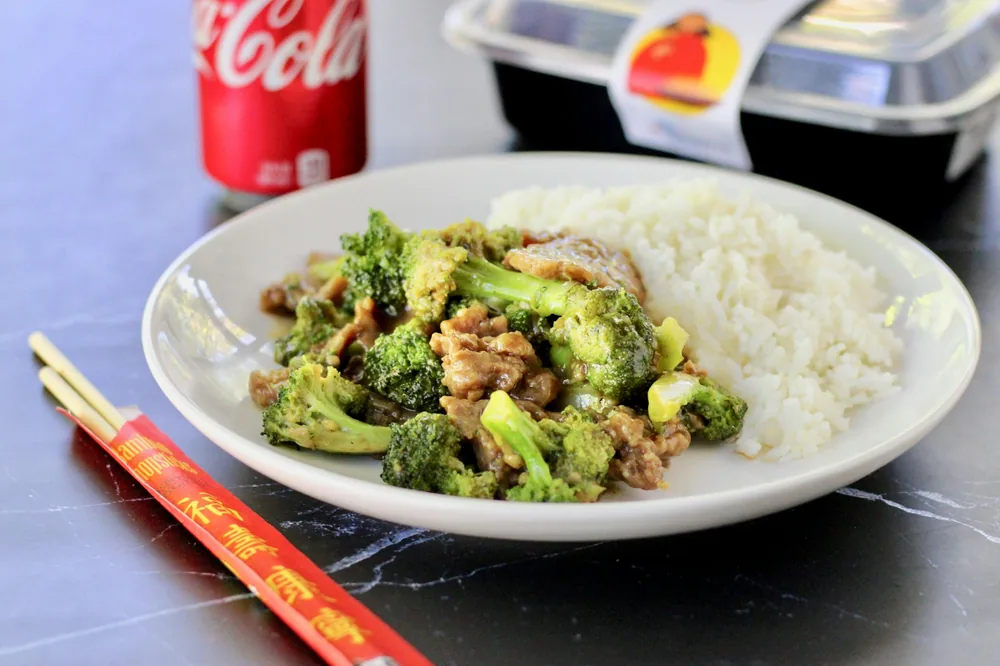 Beef and broccoli served with white rice