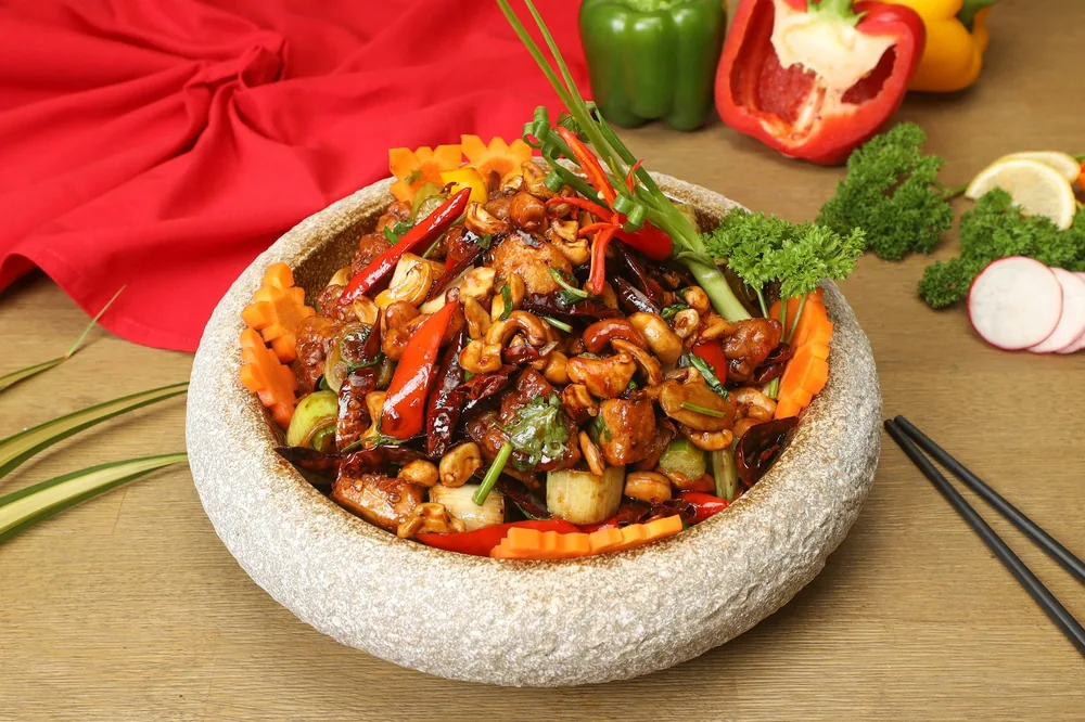 Stir fried meat and vegetables served over rice