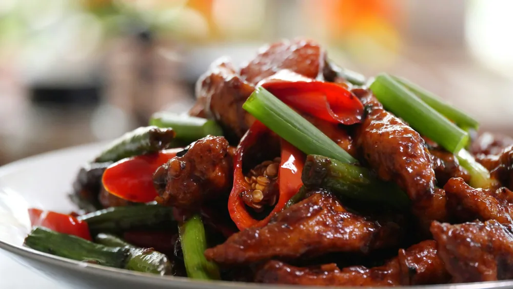 Sliced beef with peppers and scallions in a glossy sauce