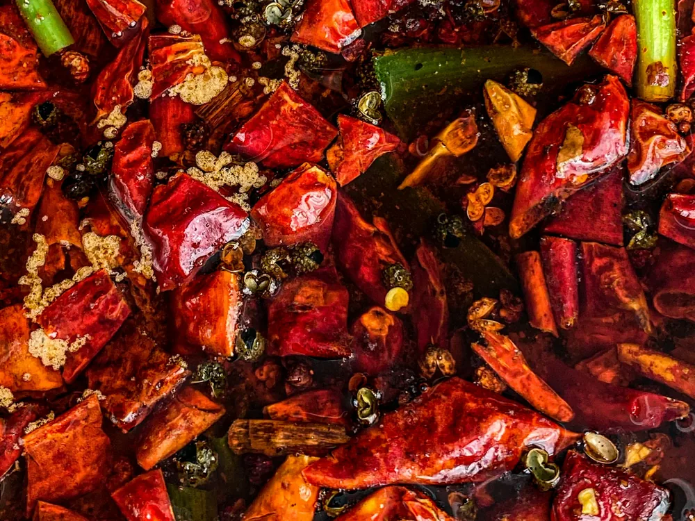 A chilli-heavy stir fry cooked in a wok