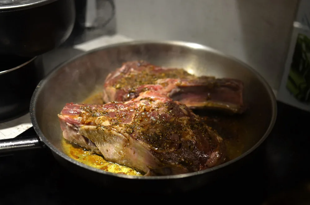 Beef searing over high heat