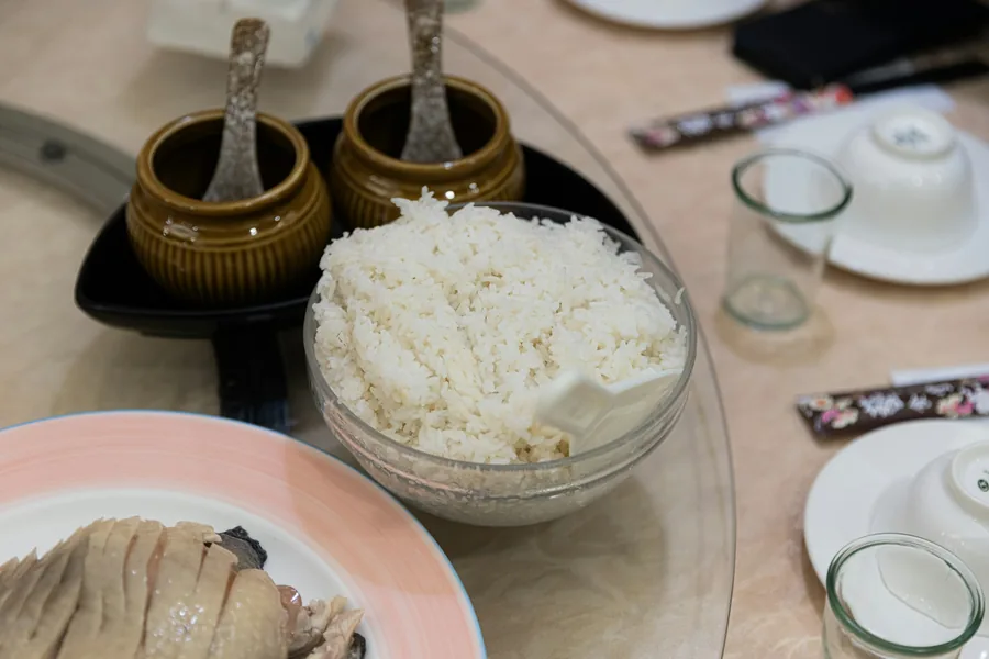 A place setting with rice and chopsticks