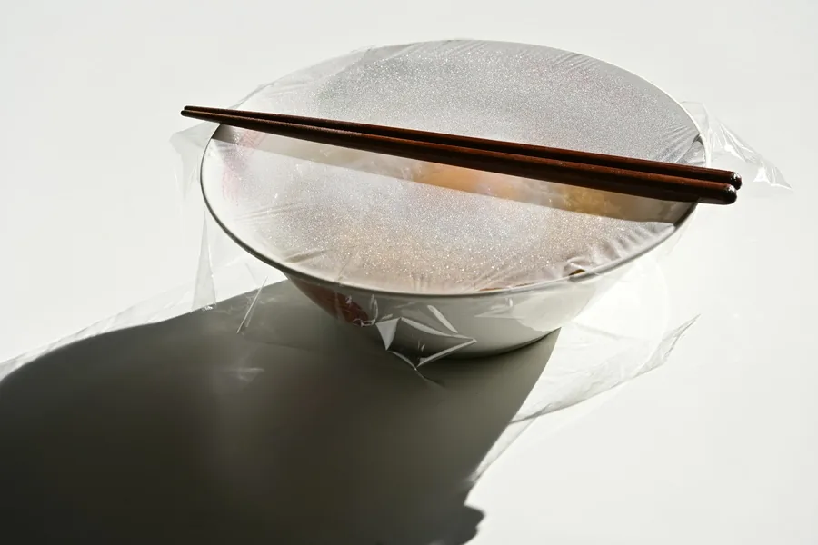Rice noodles softening in water before cooking
