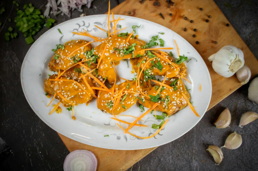 Glazed chicken finished with sesame seeds