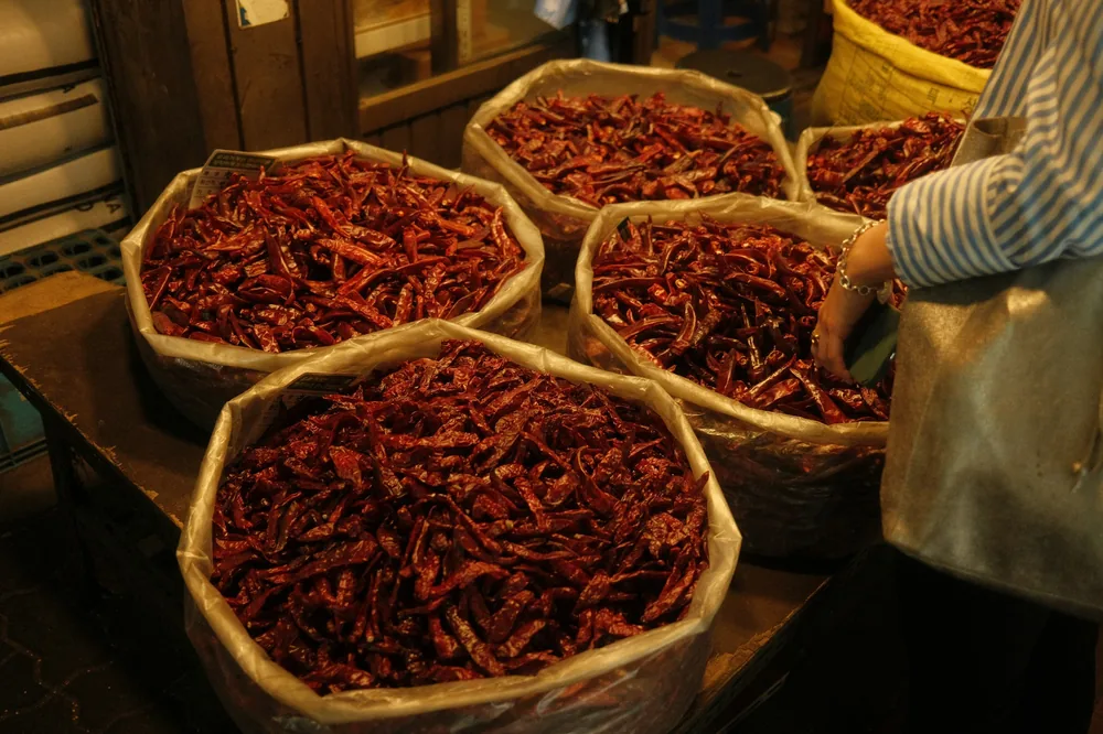 Dried chillies sold by the basket at a spice market