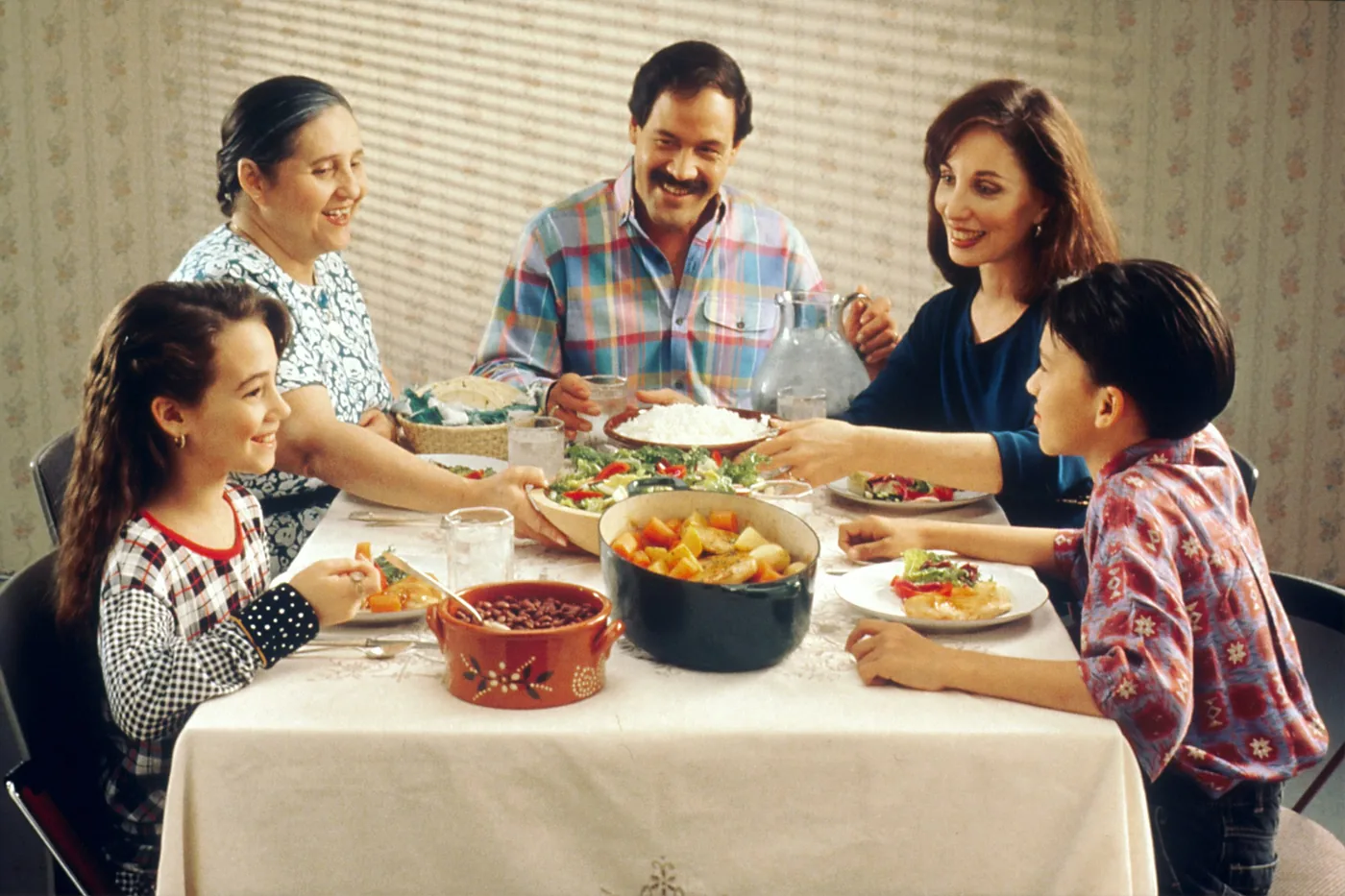 A family with children sharing dinner at one table