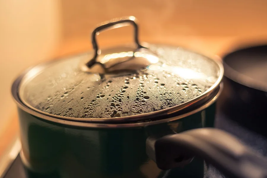Rice steaming in a covered pot