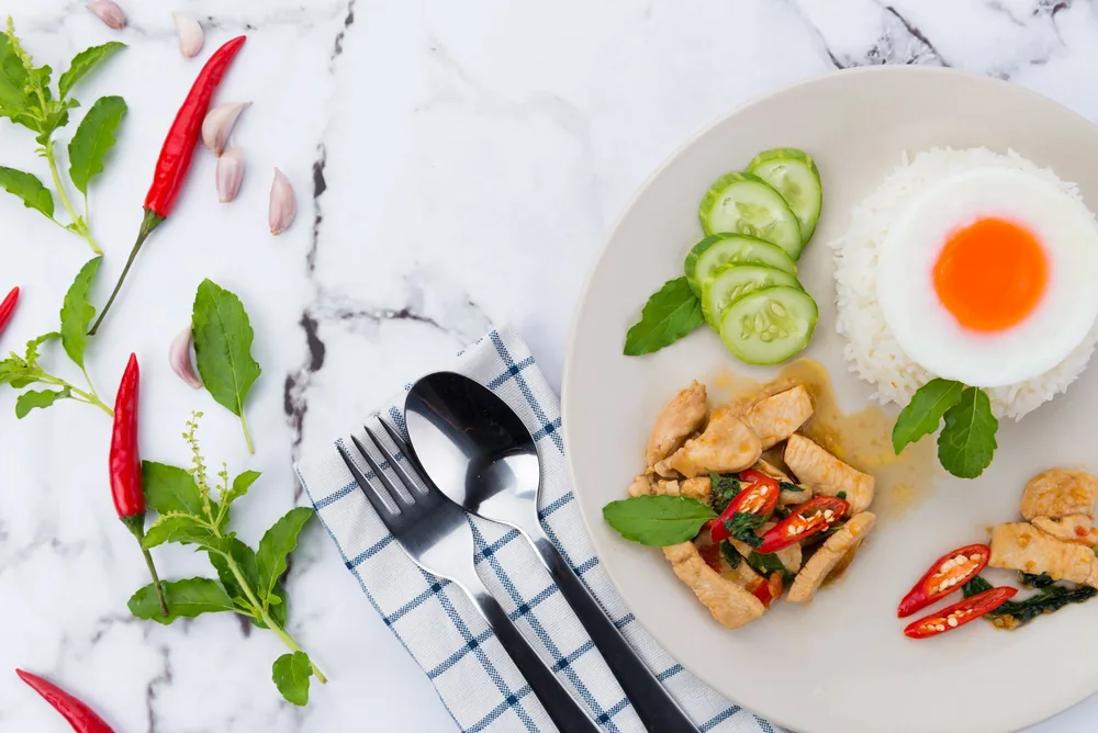 A stir fried entree served over steamed rice