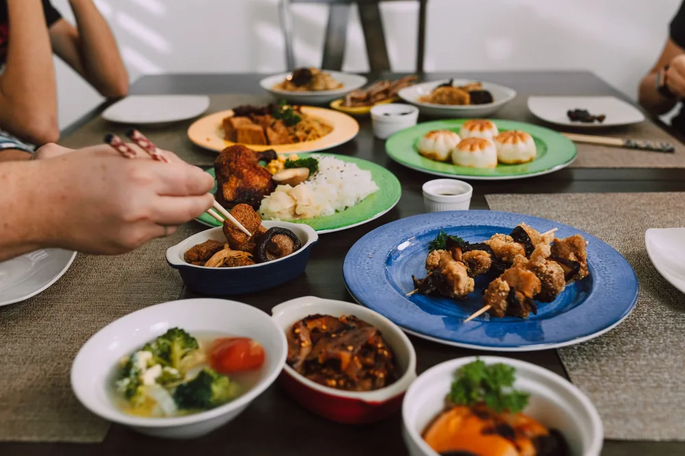 A family serving themselves from shared dishes