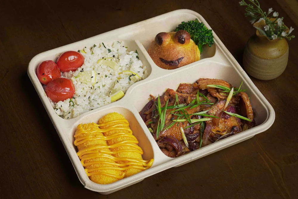 A compartmented dinner tray with several items