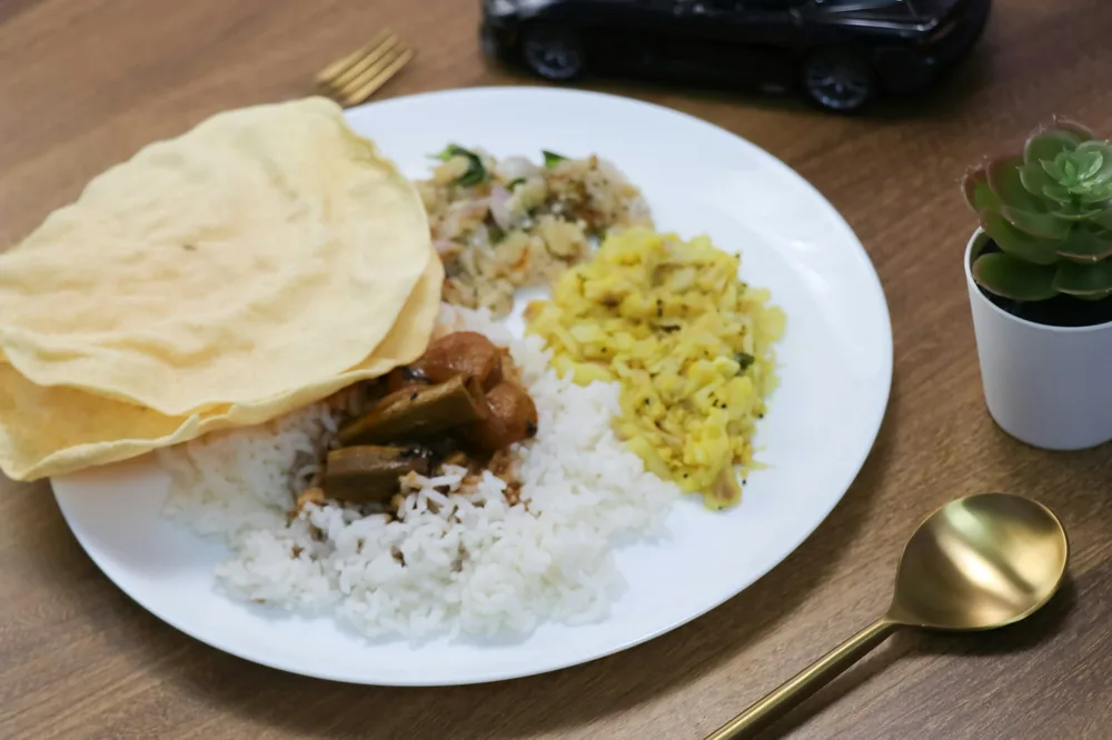 A simple lunch plate of rice and an entree
