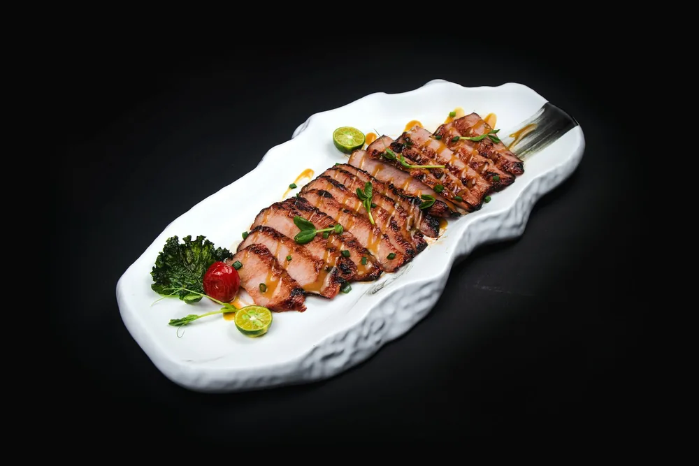Sliced roast duck served on a plate