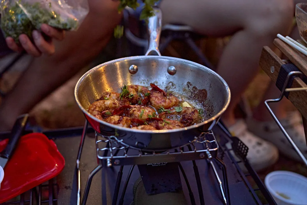 Food being reheated in a pan on the stove