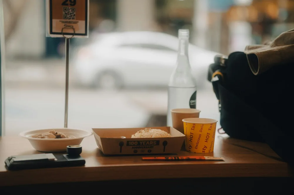 A takeout order bagged and waiting at the counter
