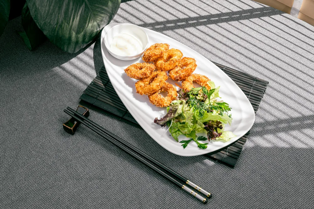 Shrimp served in a creamy sauce with walnuts