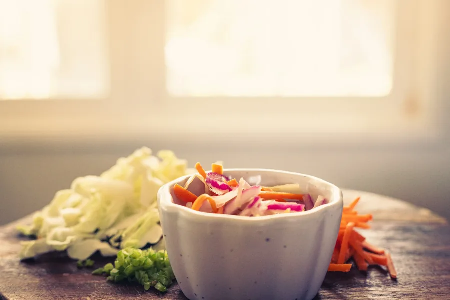 Shredded cabbage and carrot, a common roll filling