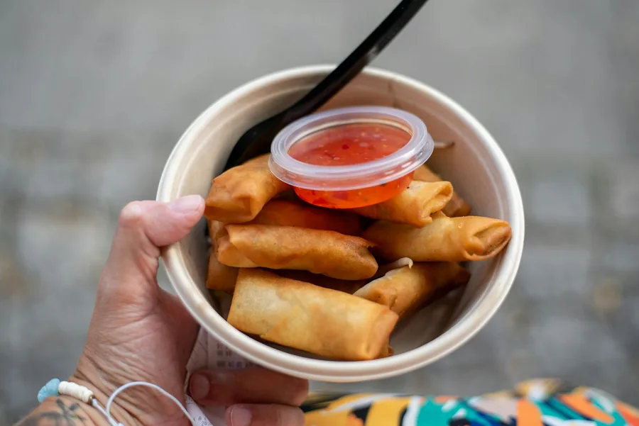 Rolls served with a dipping sauce cup