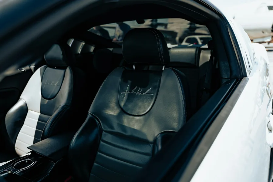 A takeout bag being carried in a car