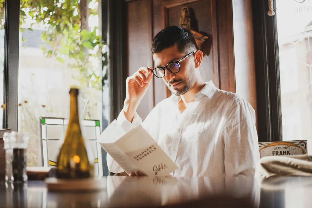 A diner reading a restaurant menu