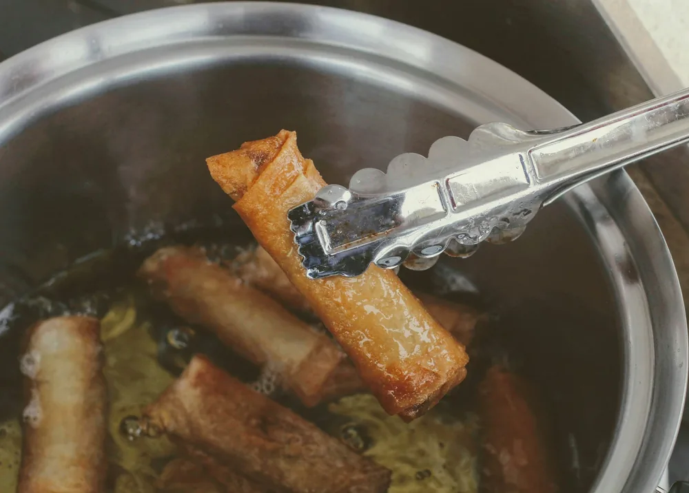 Rolls frying in hot oil