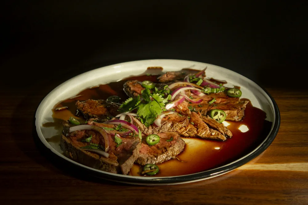 A dish finished in a dark, glossy brown sauce