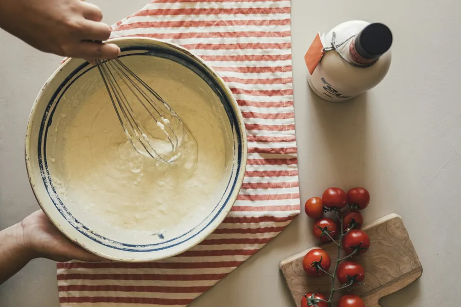 A starch and water mixture being whisked