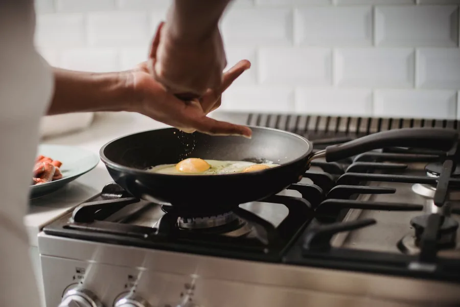 A frying pan on a domestic kitchen hob