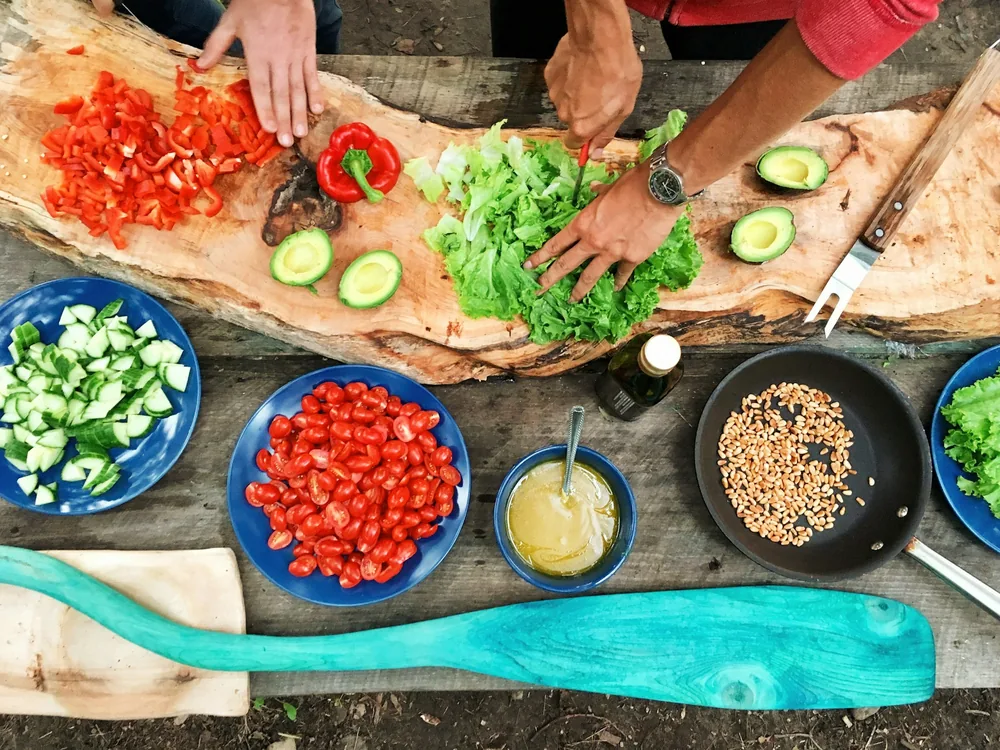 Chopped vegetables prepared in bowls before cooking