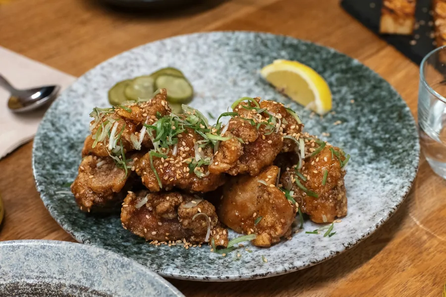 Glazed chicken pieces served on a plate