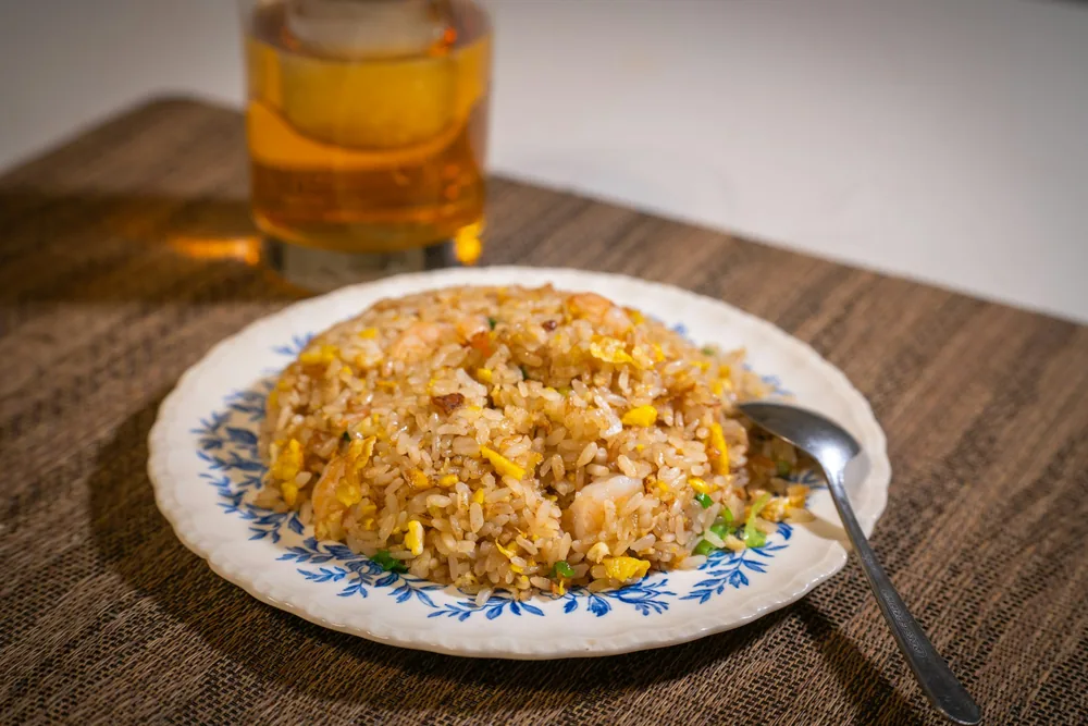 Close view of Chinese fried rice with egg and peas