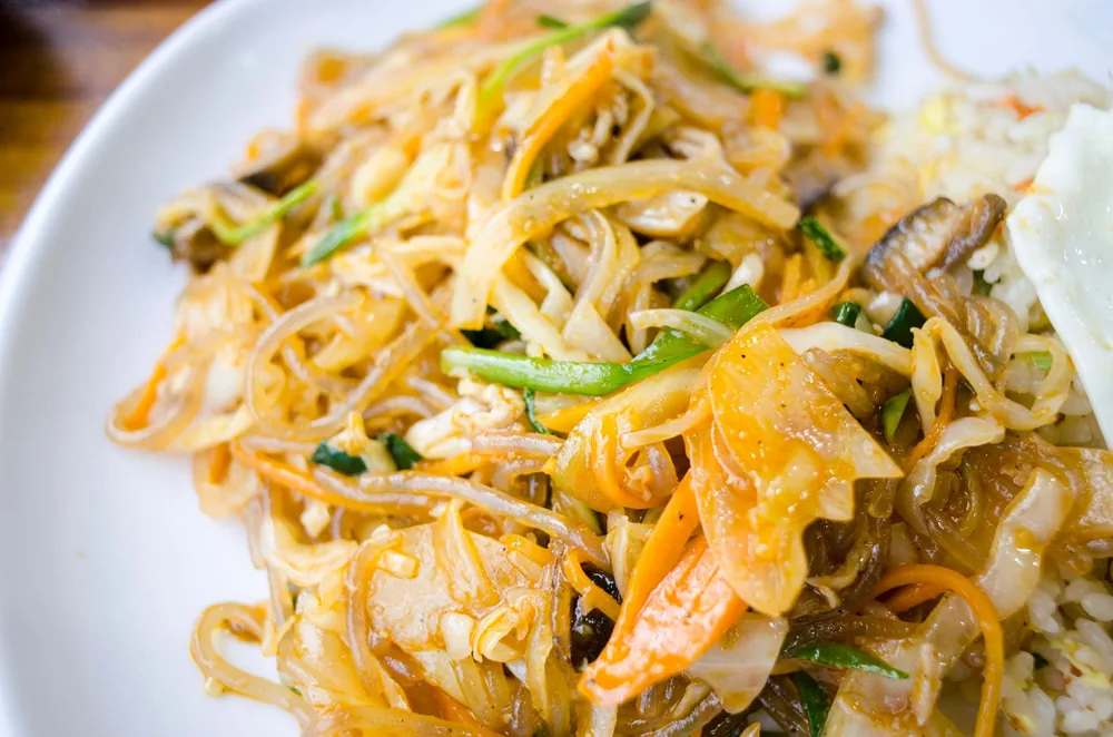Curry-tinted thin rice noodles with vegetables